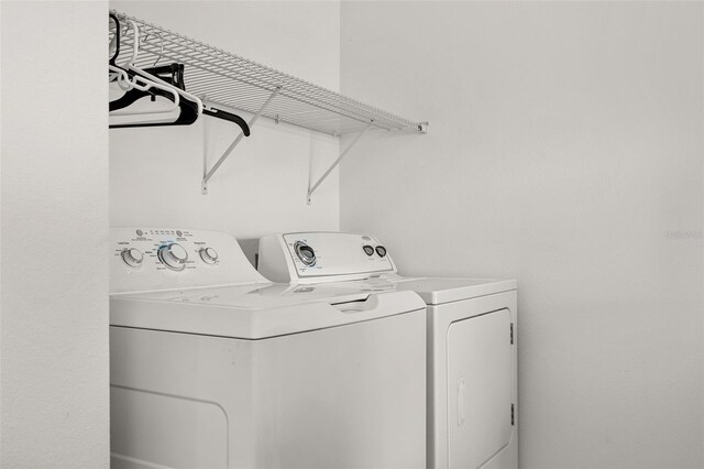 laundry room with independent washer and dryer