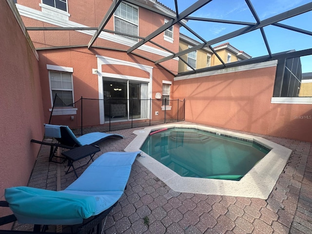 view of pool featuring a lanai and a patio