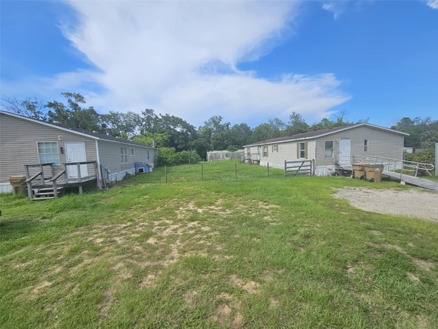 view of yard featuring a deck