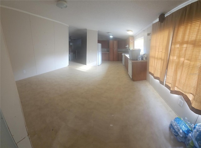 unfurnished living room with ornamental molding