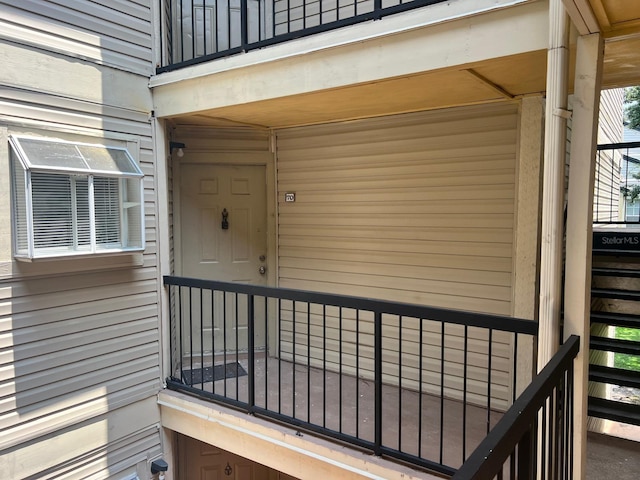 property entrance with a balcony