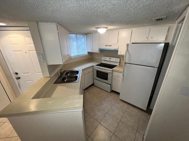 kitchen featuring a sink, light tile patterned floors, under cabinet range hood, white cabinets, and white appliances