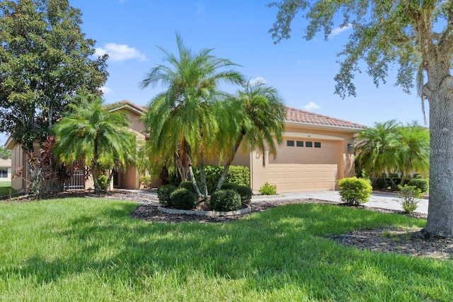 view of front facade with a garage and a front lawn