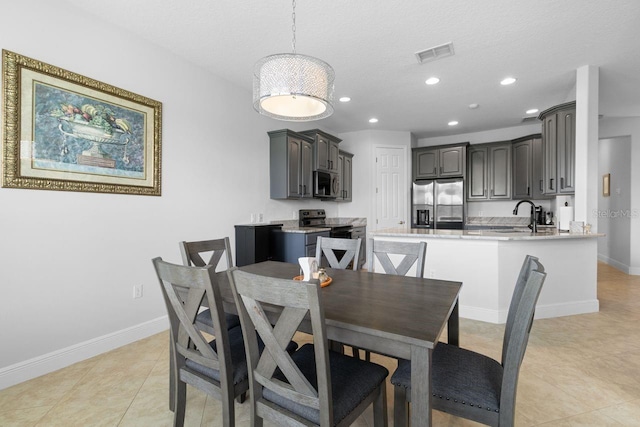 dining space featuring light tile patterned floors, recessed lighting, visible vents, and baseboards