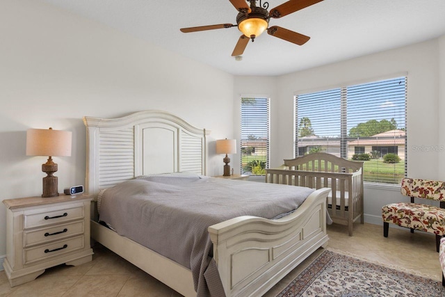 tiled bedroom with ceiling fan