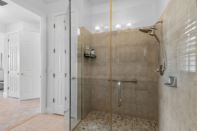 full bath featuring a shower stall, visible vents, and tile patterned flooring