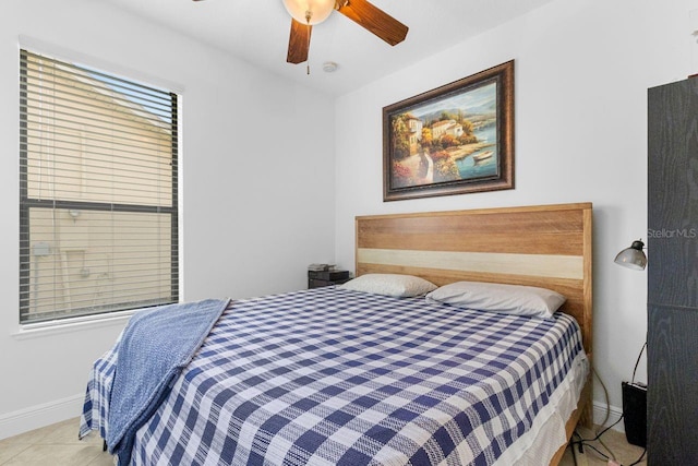 bedroom featuring ceiling fan and light tile patterned floors