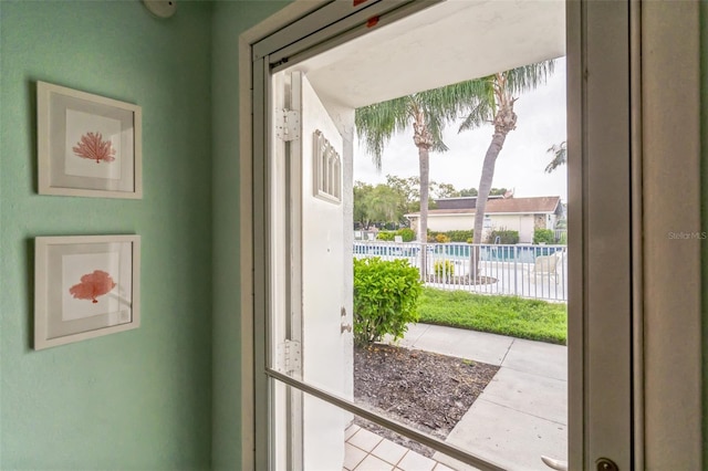 doorway featuring light tile patterned floors