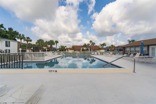 view of swimming pool featuring a patio area