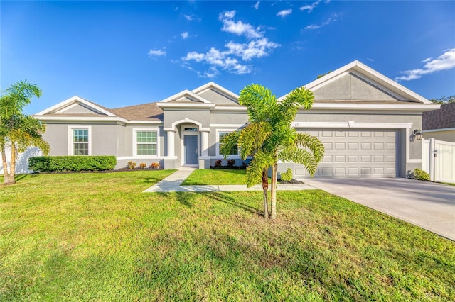 ranch-style house featuring a front yard and a garage