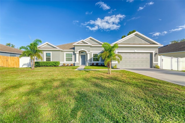 ranch-style house featuring a front yard and a garage