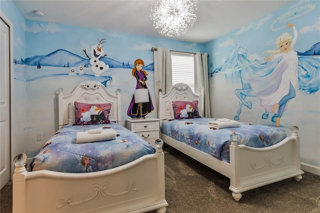 carpeted bedroom featuring a chandelier