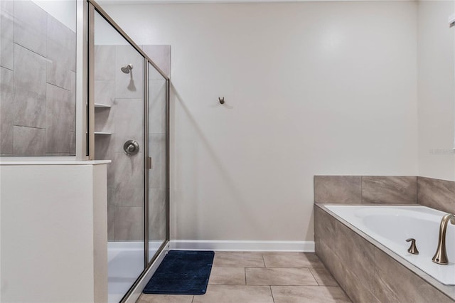 bathroom featuring separate shower and tub and tile patterned floors