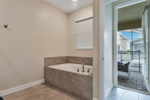 bathroom featuring tiled bath and tile patterned floors