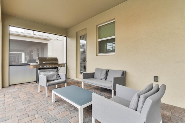 view of patio with grilling area and an outdoor living space