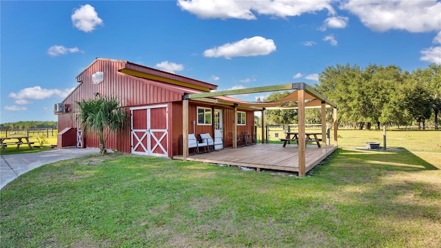 exterior space featuring a lawn and an outdoor structure