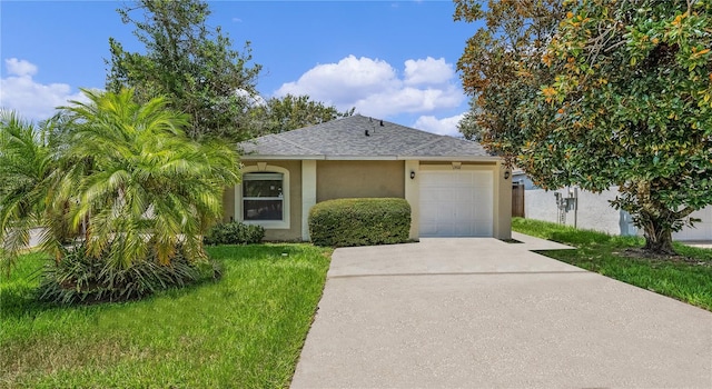 view of front of property featuring a garage and a front yard