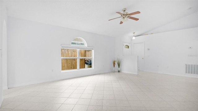 tiled empty room featuring high vaulted ceiling and ceiling fan