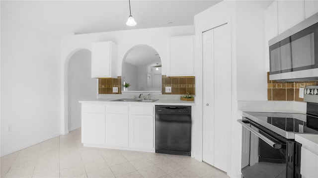 kitchen with black dishwasher, backsplash, electric stove, light tile patterned floors, and white cabinets