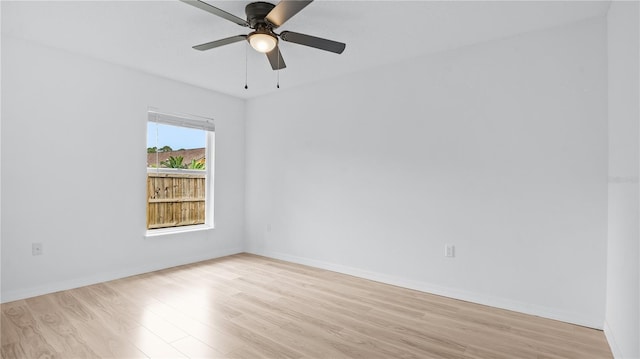 spare room with ceiling fan and light hardwood / wood-style flooring