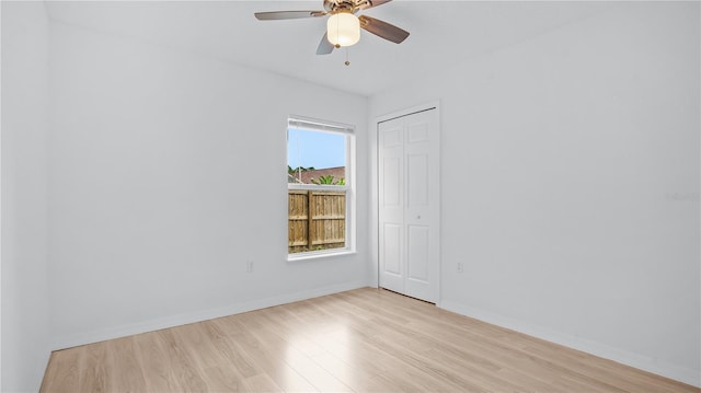 empty room featuring light hardwood / wood-style flooring and ceiling fan