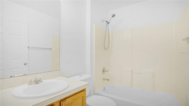 full bathroom featuring washtub / shower combination, toilet, and vanity