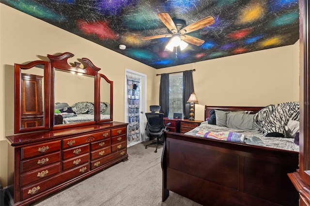 bedroom with a ceiling fan and light colored carpet