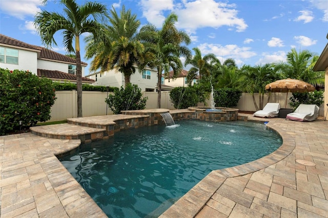 view of swimming pool featuring an in ground hot tub, a patio, and pool water feature