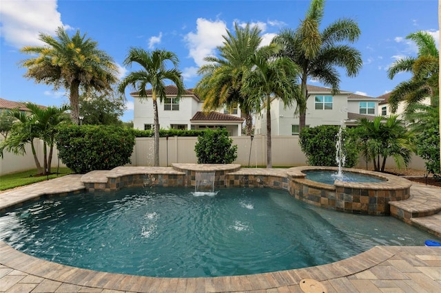 view of swimming pool with pool water feature