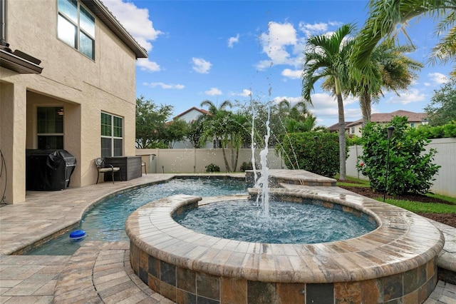 view of swimming pool featuring a fenced backyard and grilling area