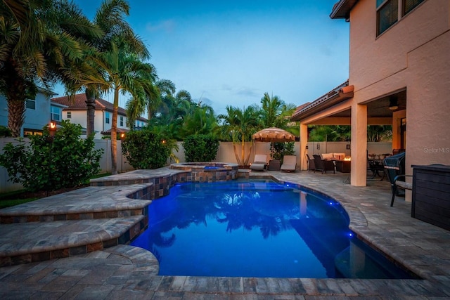 view of swimming pool with a patio area and an in ground hot tub