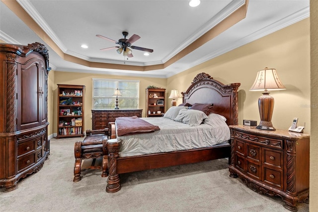 bedroom with light carpet, ornamental molding, a raised ceiling, and recessed lighting