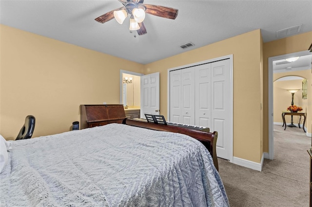 bedroom featuring ceiling fan, carpet, and a closet