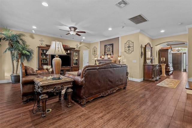 living room with ceiling fan, crown molding, and hardwood / wood-style flooring