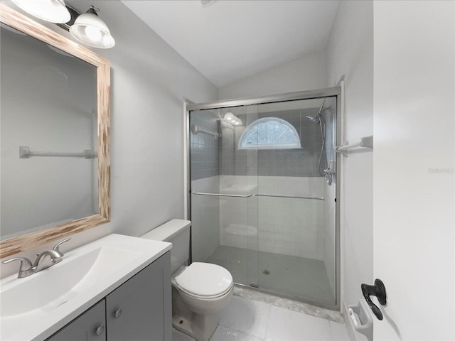 bathroom with vanity, vaulted ceiling, toilet, and walk in shower