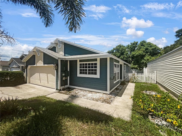 view of side of home with a garage