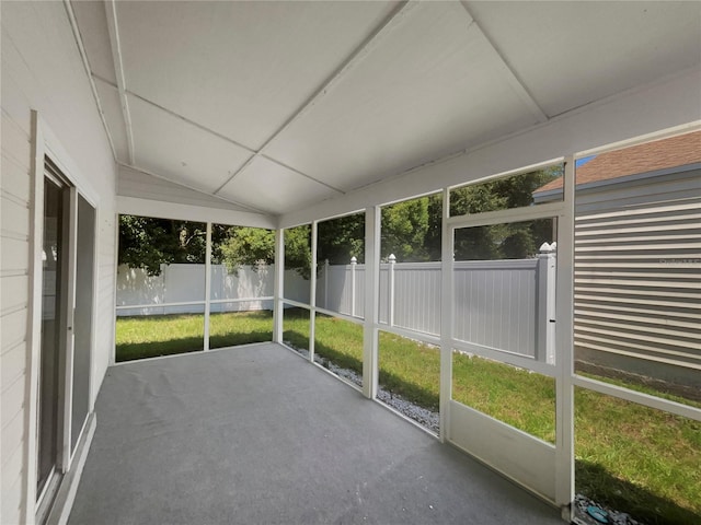 unfurnished sunroom with vaulted ceiling