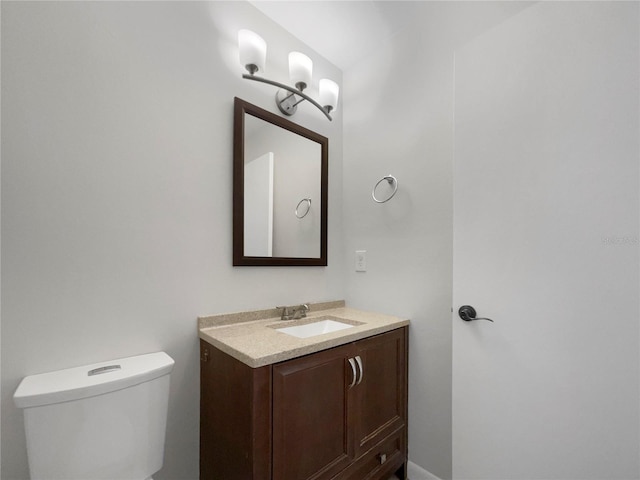 bathroom with toilet and vanity