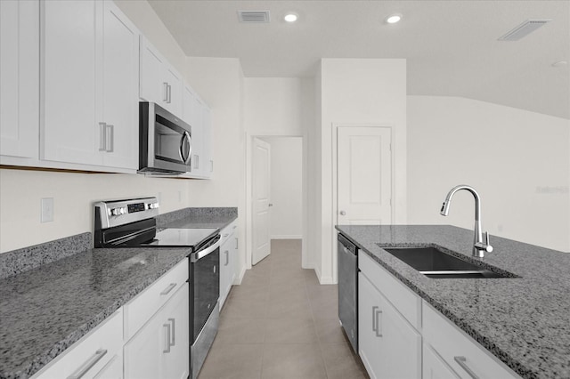 kitchen featuring sink, stone countertops, appliances with stainless steel finishes, and white cabinets