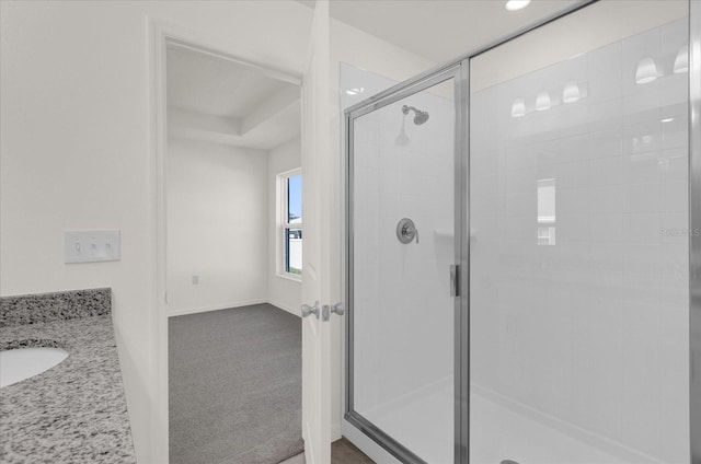 bathroom with vanity and walk in shower