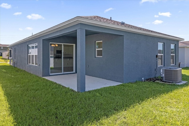 back of house featuring a patio area, cooling unit, and a yard