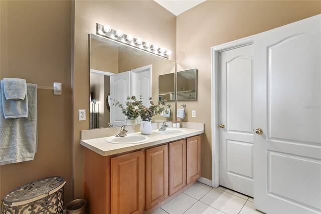 bathroom featuring double vanity and tile patterned floors