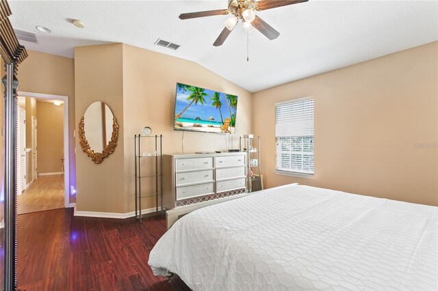 bedroom featuring ceiling fan, vaulted ceiling, and dark hardwood / wood-style floors