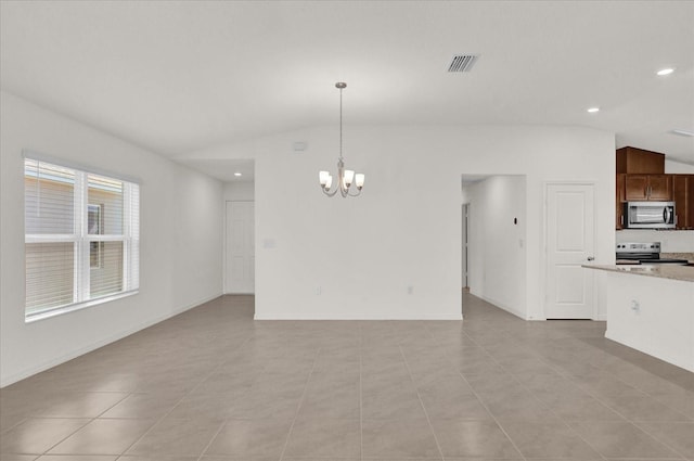 interior space featuring light tile patterned floors, vaulted ceiling, and a chandelier