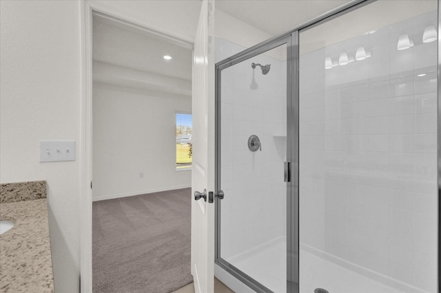 bathroom featuring vanity and walk in shower