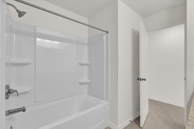 bathroom featuring tile patterned floors and tub / shower combination