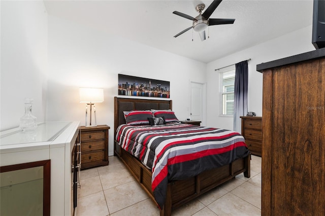 tiled bedroom with ceiling fan