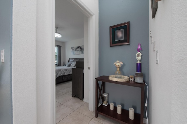 hallway featuring light tile patterned floors