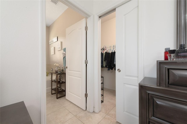 hallway with light tile patterned floors