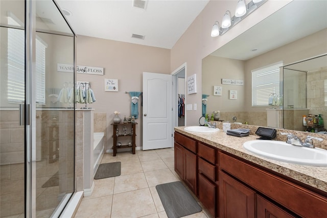 bathroom with tile patterned floors, vanity, and independent shower and bath